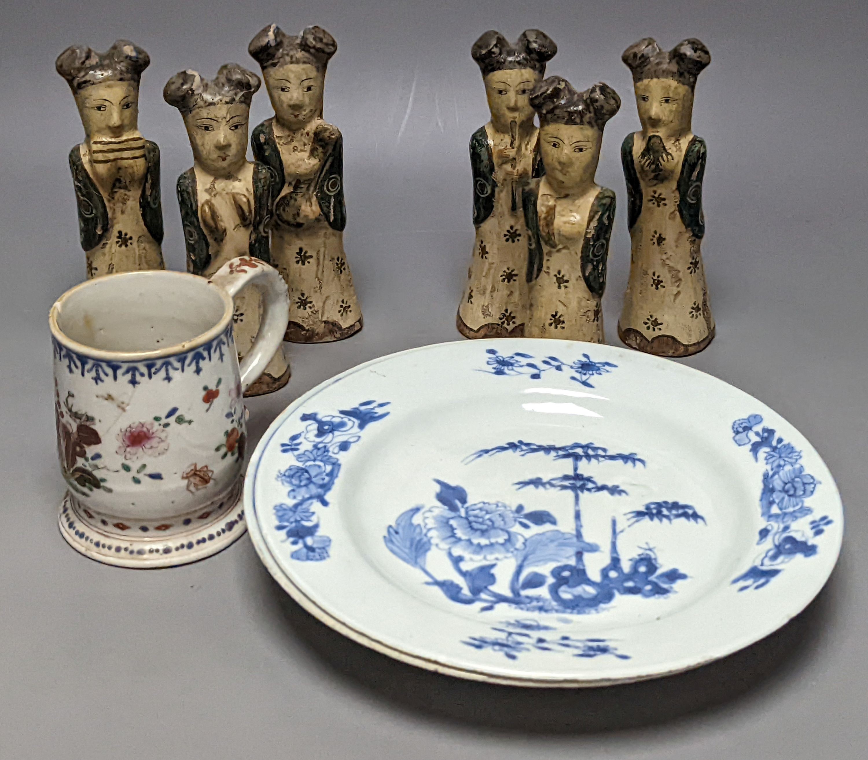 Six Chinese pottery figures and a mug and two plates, largest plate 24 cms diameter.